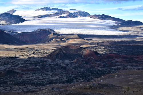 A beautifully preserved cinder cone identified as SLF-11 in Mount Edziza's Snowshoe Lava Field.      Photograph captured in Mount Edziza Provincial Park 2023. 